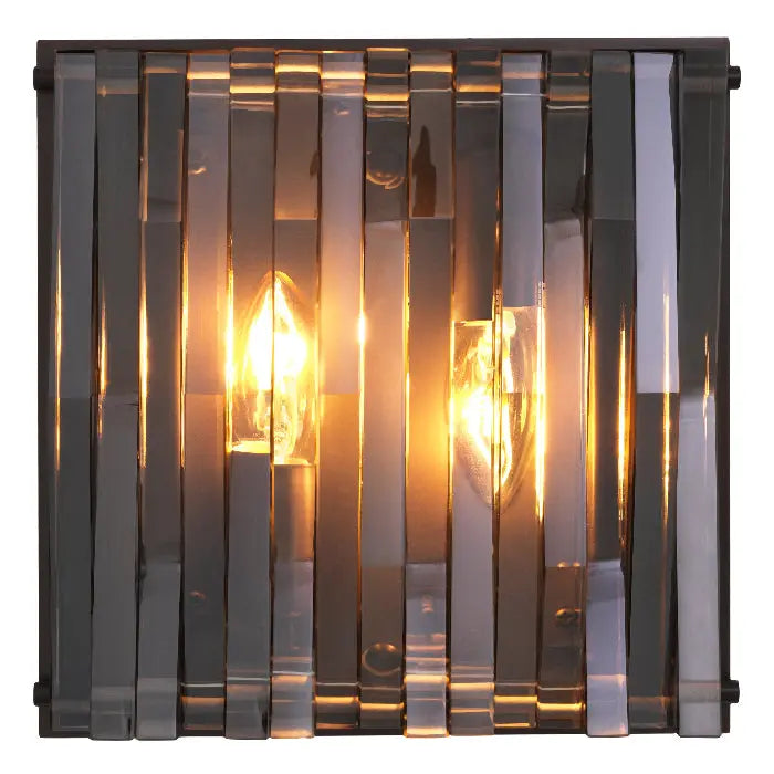 Decorative wall light with glass panels on a white background