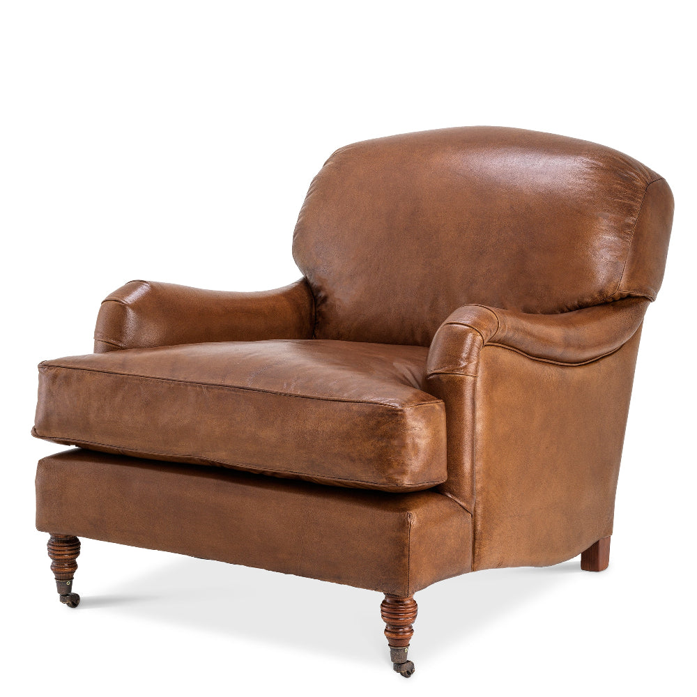 A brown leather upholstered armchair with wooden legs, designed in a traditional style.