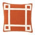 A square-shaped orange and white hand embroidered cushion with a geometric pattern.