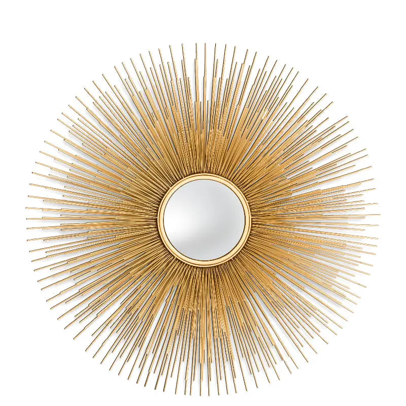 A gold finish convex mirror with a sunburst silhouette frame.