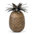 A decorative pineapple-shaped box with an engraved brass body and an antique silver finish.