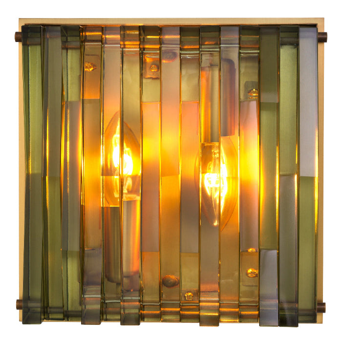 Decorative wall light fixture with glass panels on a white background