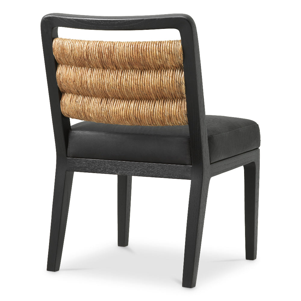 Chair with black frame, woven backrest, and black cushion on a white background
