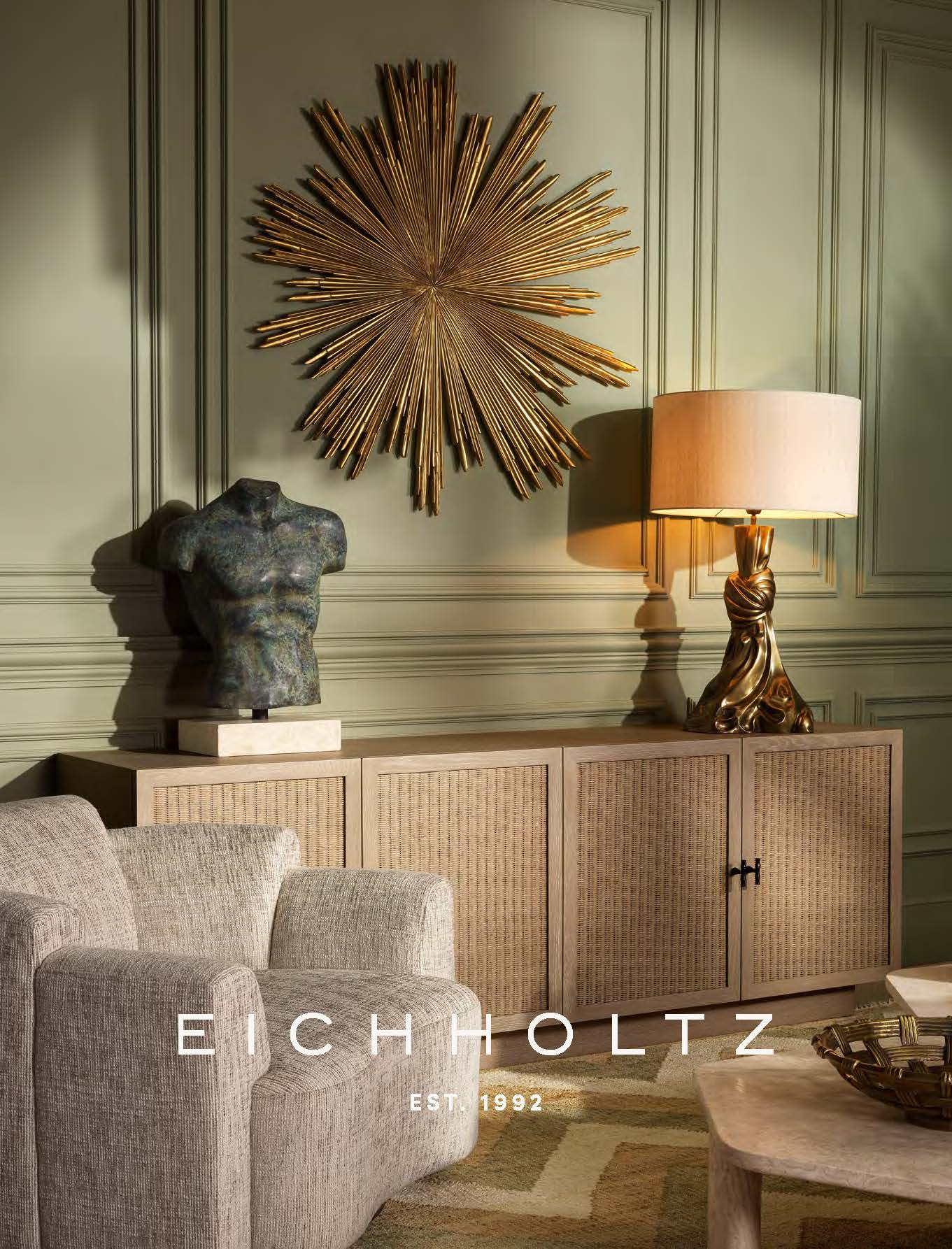 Living room with Eichholtz furniture and decor, including a large gold wall art piece.